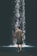 man walking near waterfalls