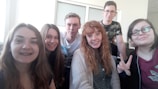 A joyful group of friends posing for a photo together.