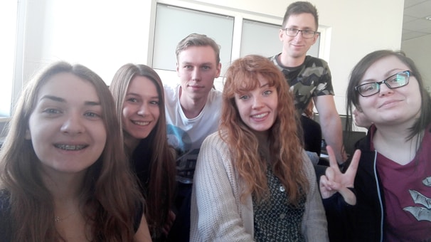Group photo of interns laughing together in the company lounge