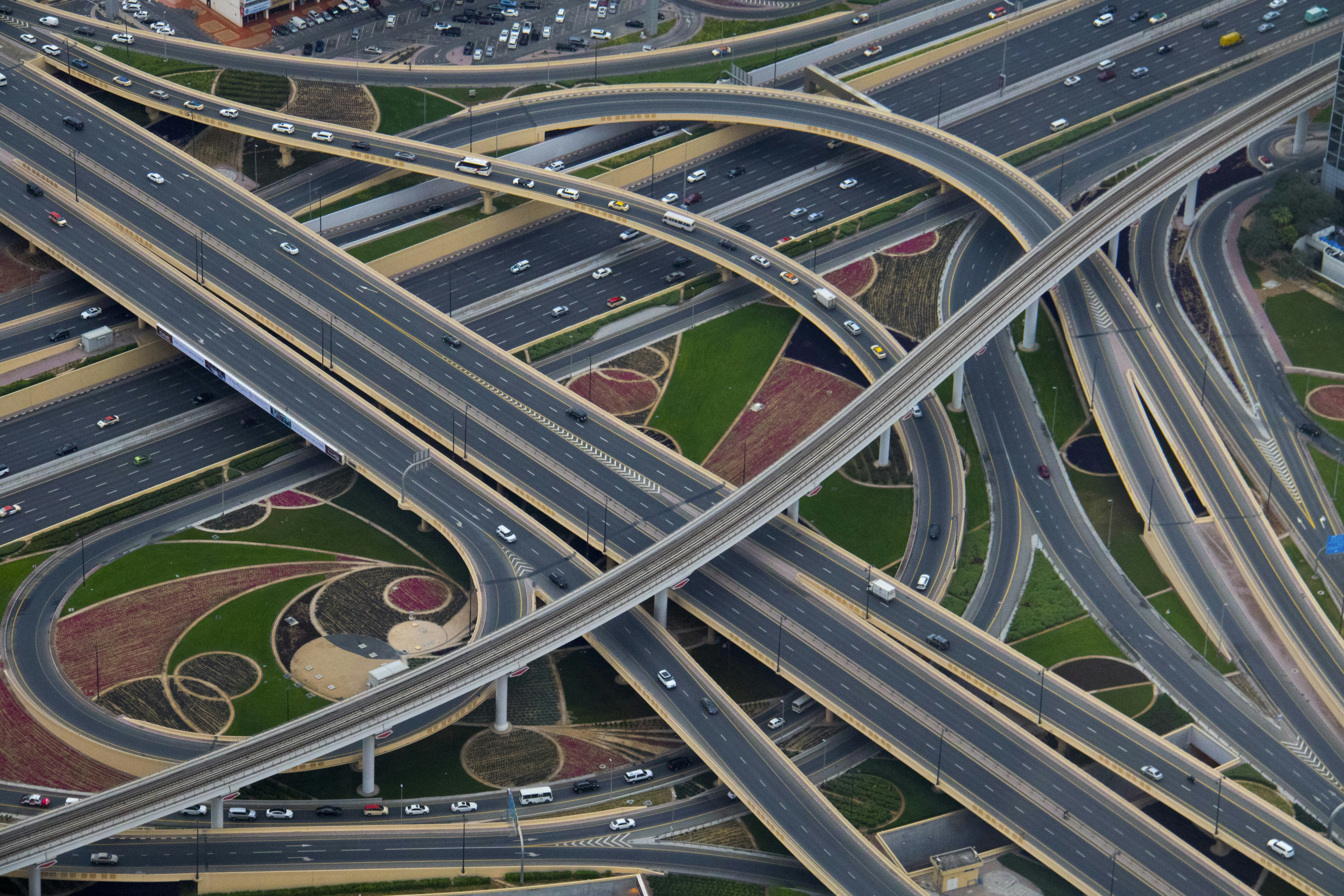 great photo recipe,how to photograph i was on vacation in dubai last week and went to the top of the burj khalifa, the tallest building in the world at just over half a mile high.  i looked down and took this photo of the road network around it.  absolutely mind-boggling how they construct all these huge roads and networks.; aerial photography of gray concrete roads