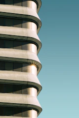 Completed contemporary building exterior with clean lines and natural stone textures under soft daylight.