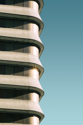 Stucco exterior finish on a modern residential building glowing in sunlight.