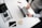 person using laptop on white wooden table