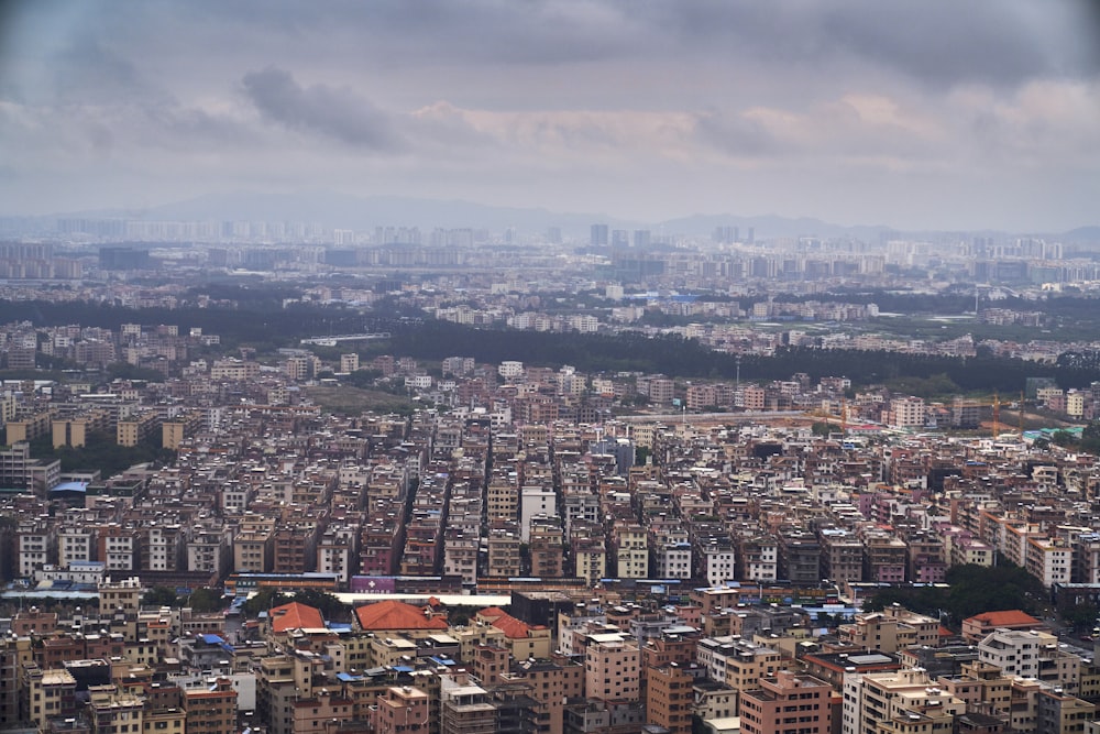 aerial photography of buildings under cloudy sky at daytime