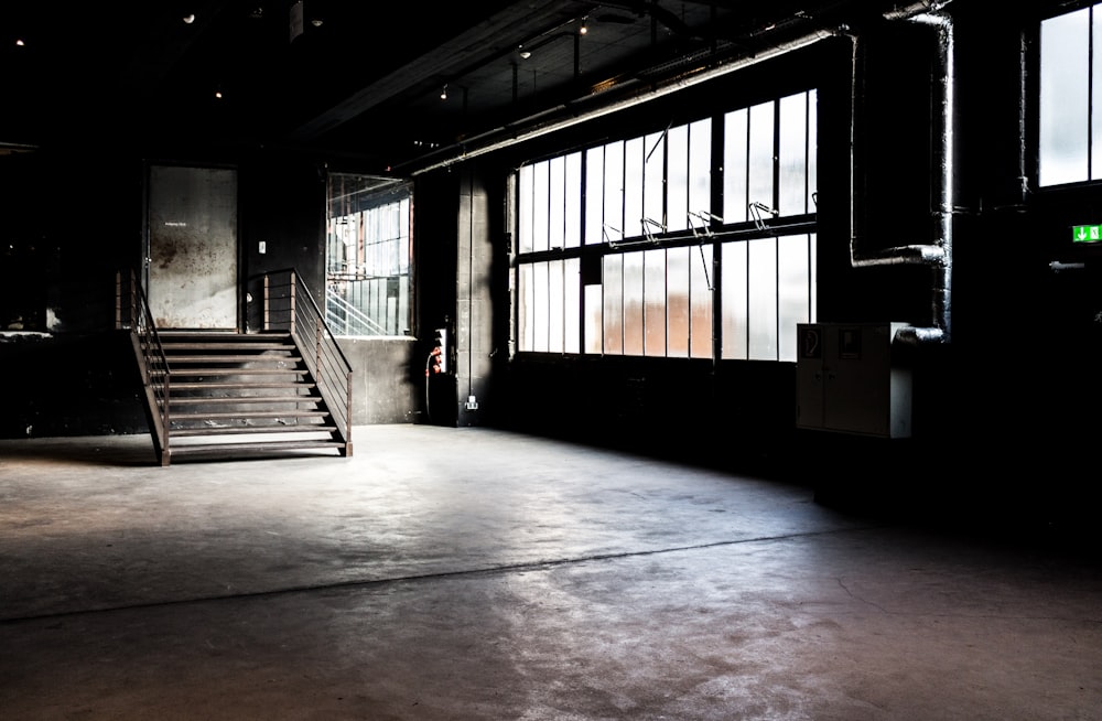 gray steel stairway and white door