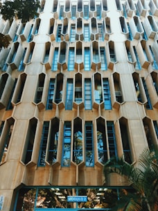 Close-up of Binghatti's unique facade featuring geometric patterns and greenery.