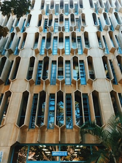 Close-up of Binghatti's unique facade featuring geometric patterns and greenery.
