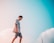 man in gray crew-neck shirt walking