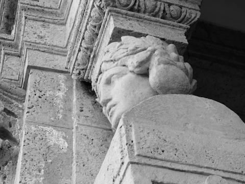 Close-up of a finely chiseled granite sculpture with natural textures.
