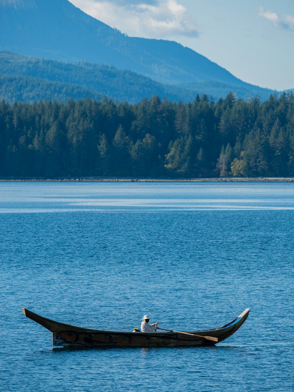 person rowing canoe