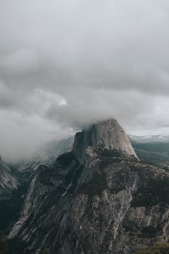 gray and green mountain under gray clouds in Yosemite National Park, Half Dome United States