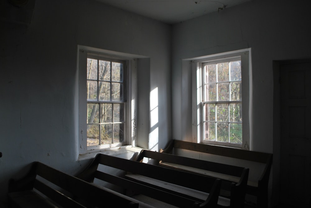 four brown wooden benches inside house