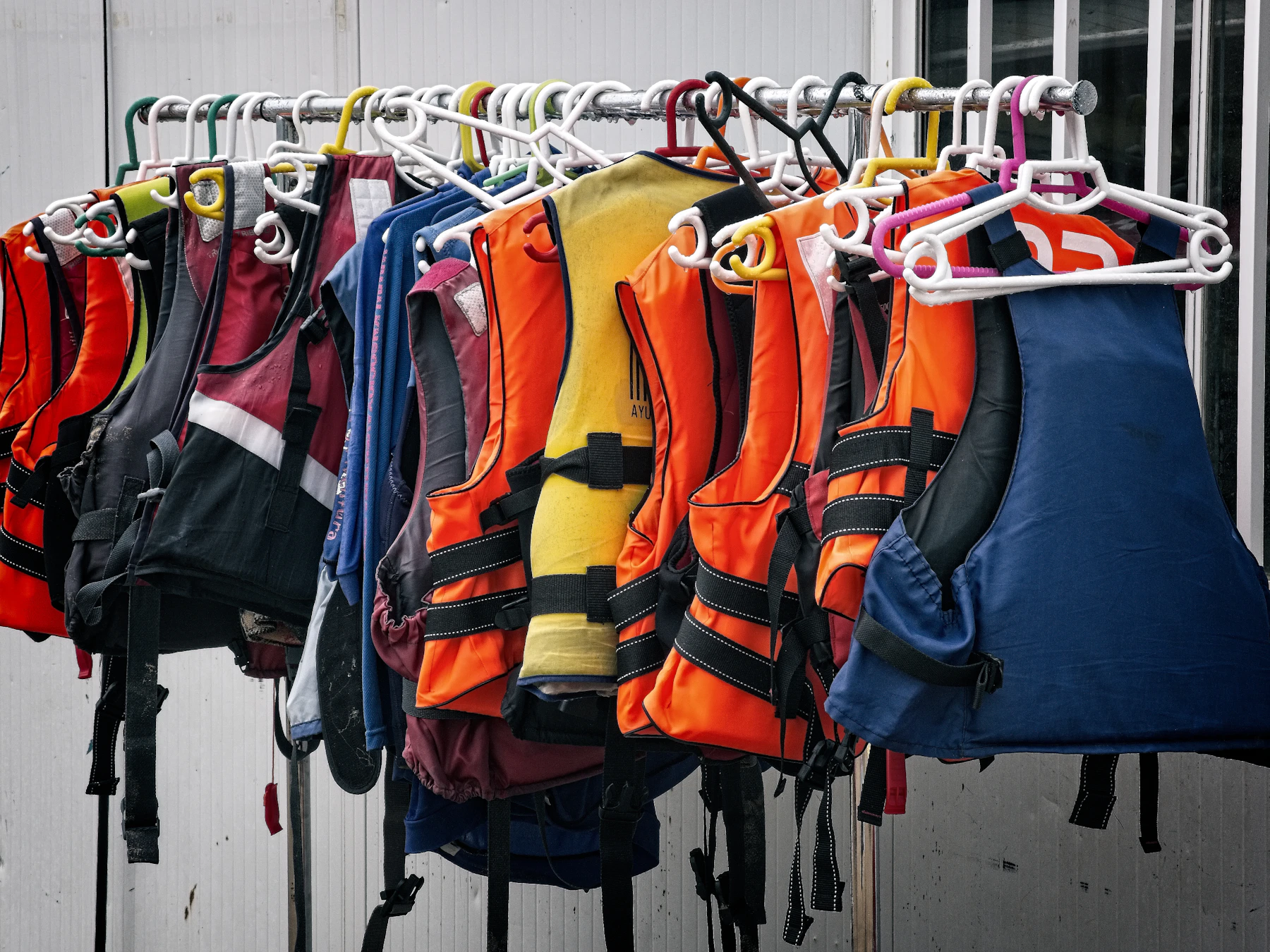Colorful life jackets arranged for water safety