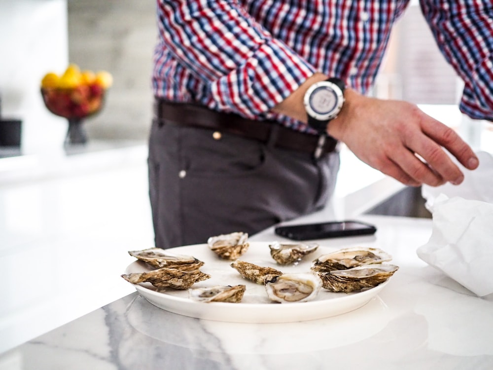 seashell dish on white ceramic platter