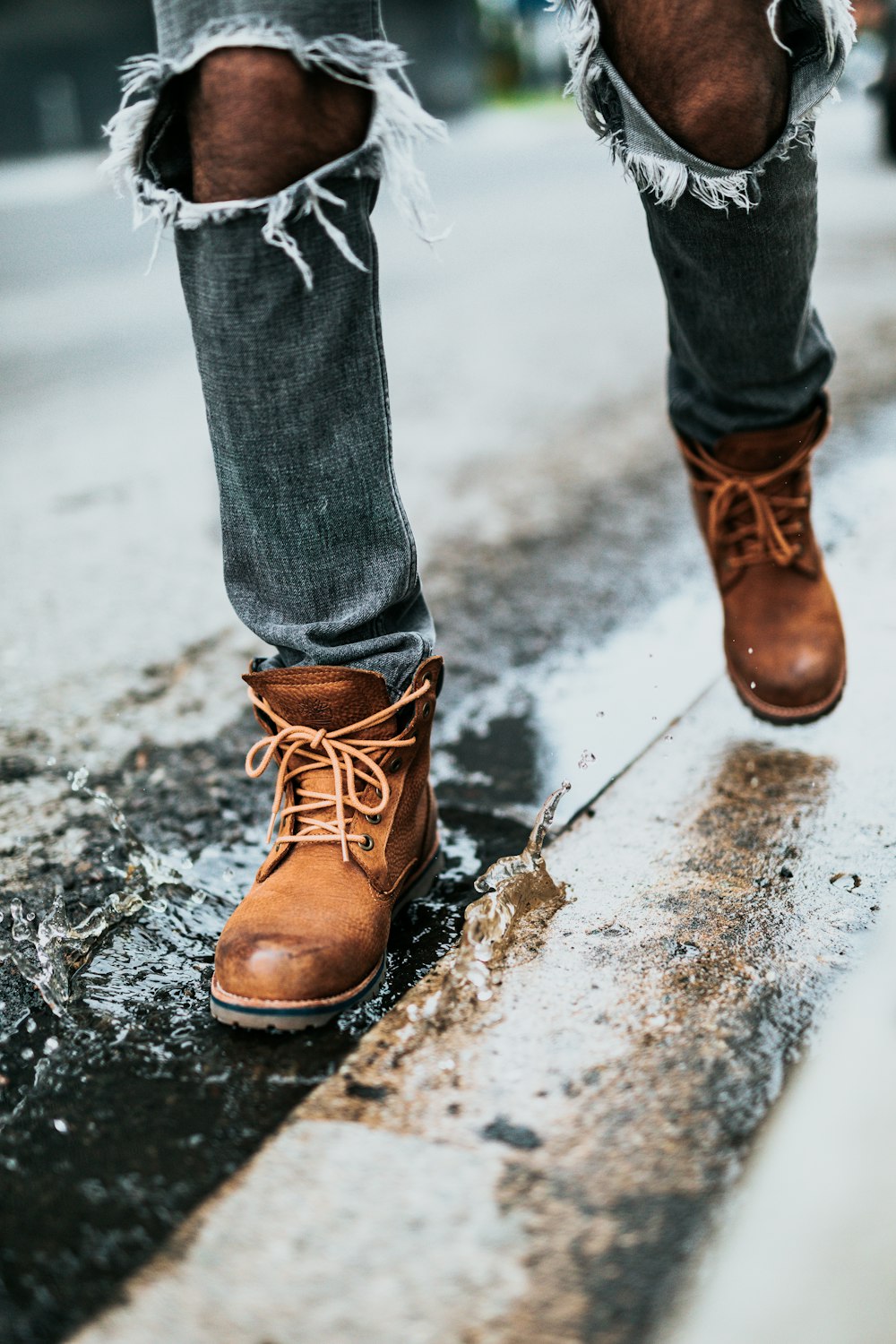 person walking on wet street