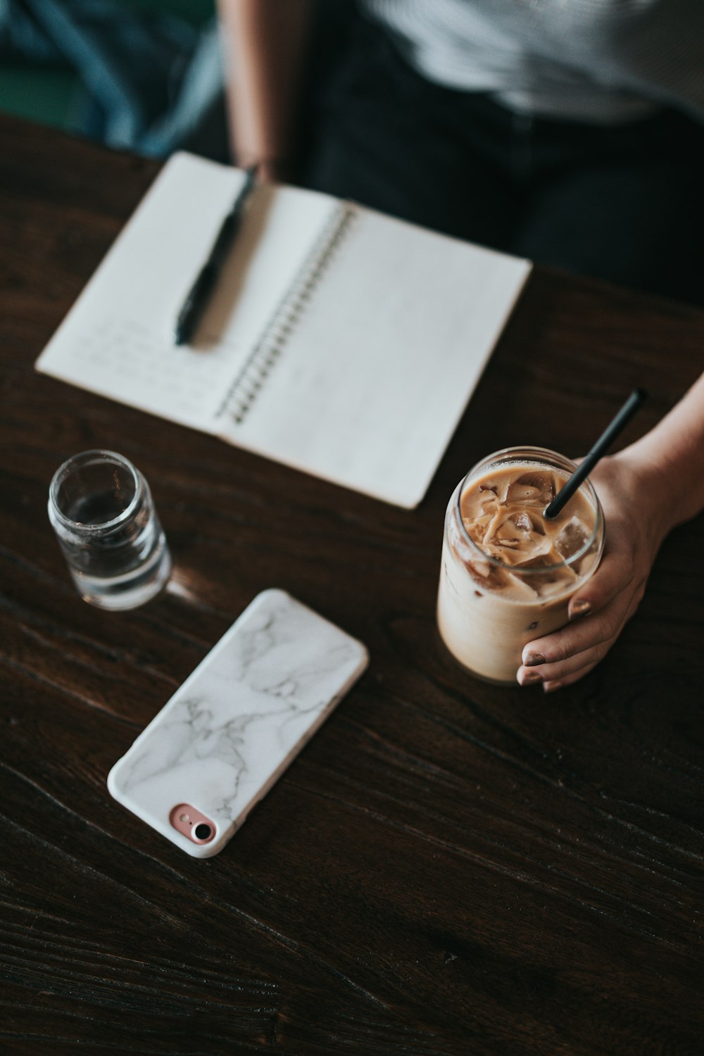 person holding cup of coffee