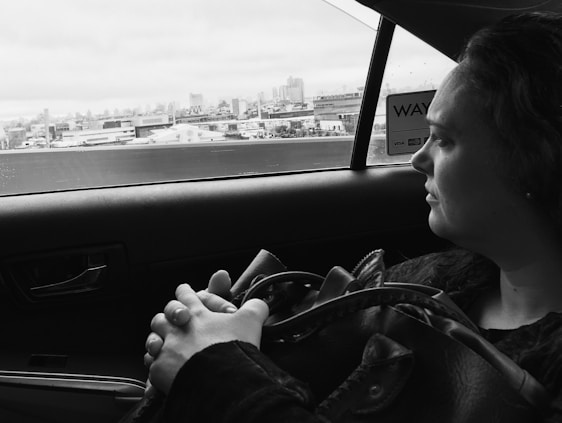 A thoughtful woman reviewing strategic plans with a digital cityscape background symbolizing future growth.