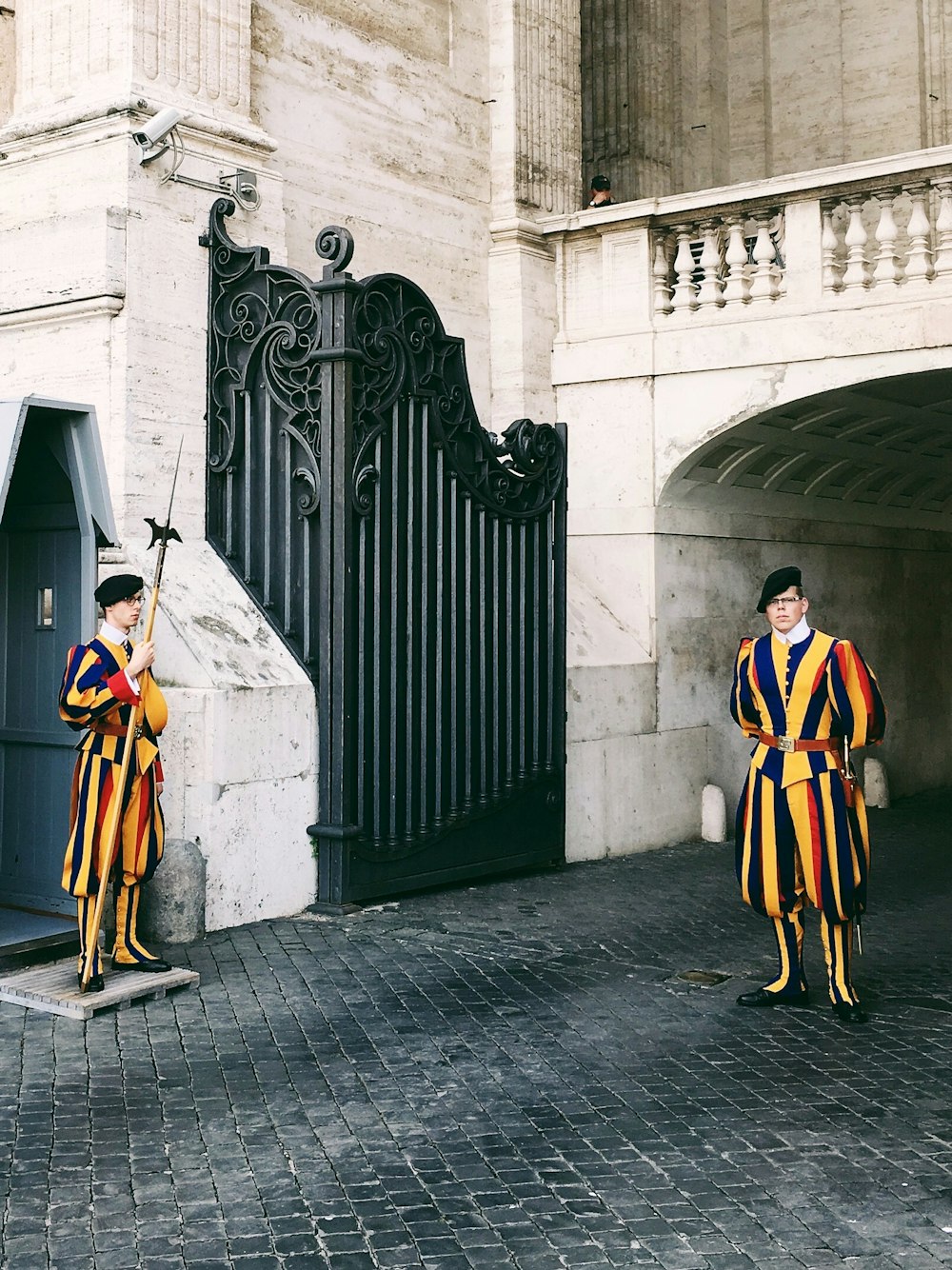 man standing near gate