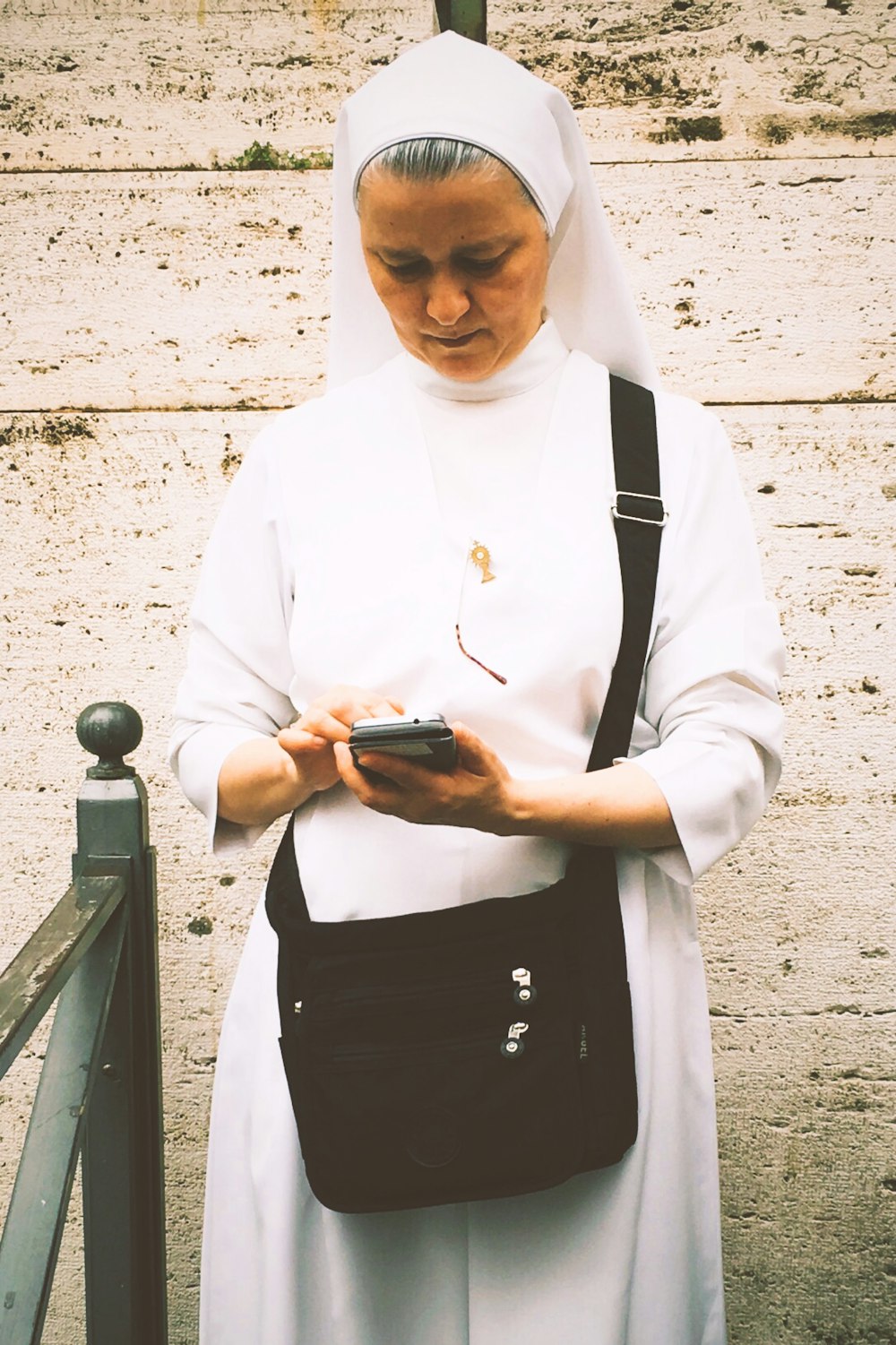 nun using smartphone