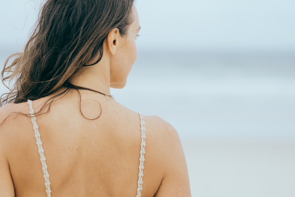 person taking photo of women's back