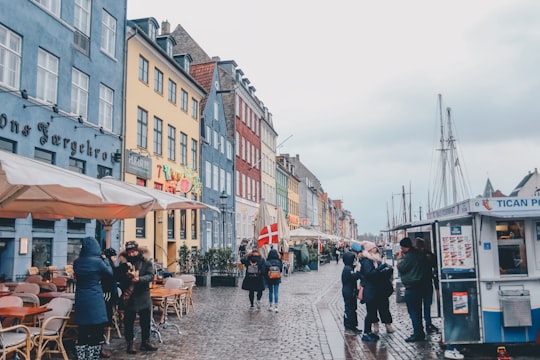 people walking building under cloudy sky during daytime in Mindeankeret Denmark