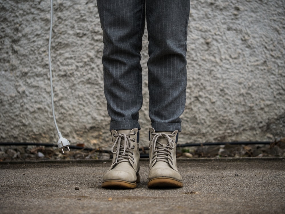 person wearing gray boots