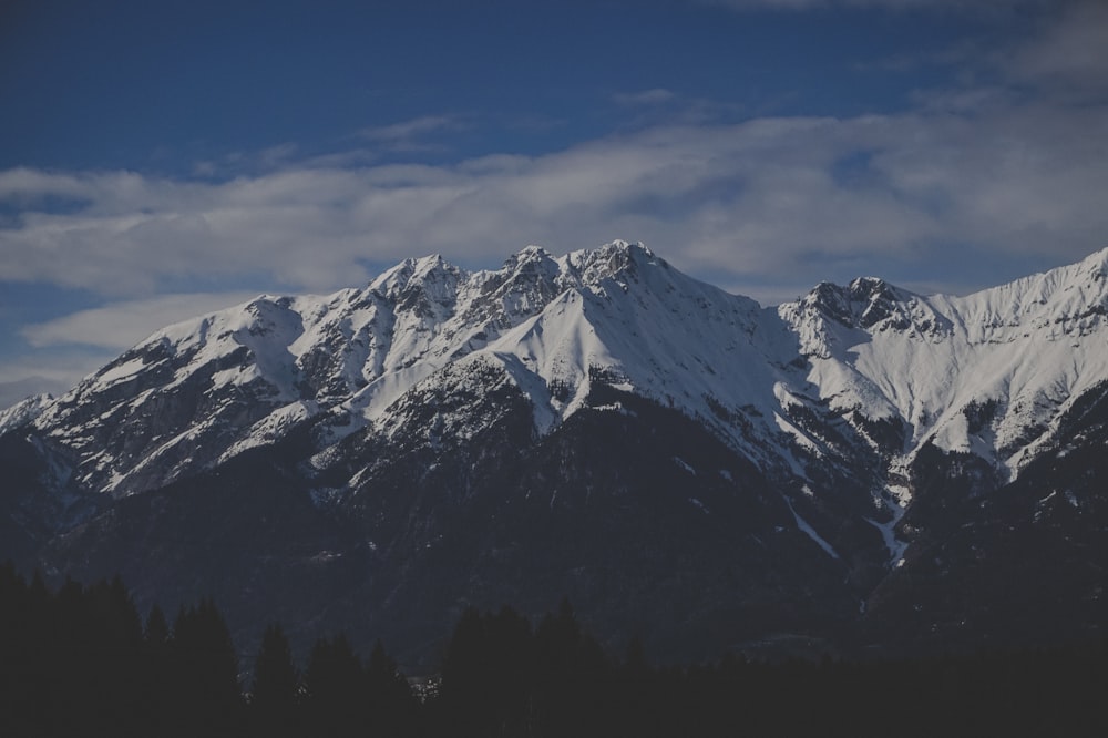 landscape photography of mountain covered with snow under the blue sky