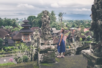 woman standing at the stairs inside landmark