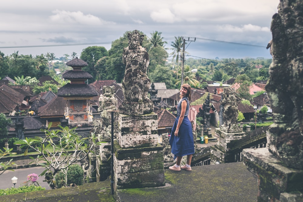 woman standing at the stairs inside landmark