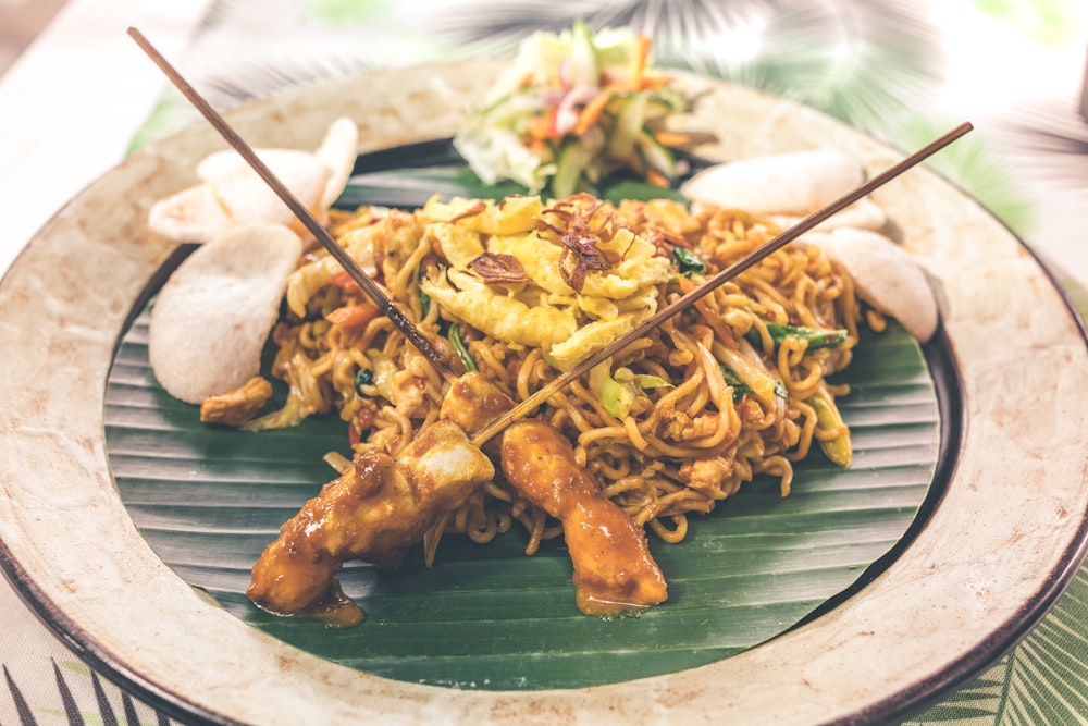 stir fry noodles and barbecue with side dish