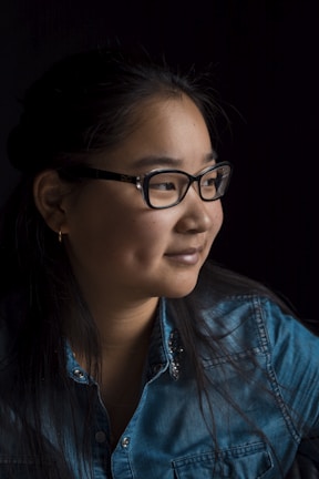 girl wearing black framed eyeglasses