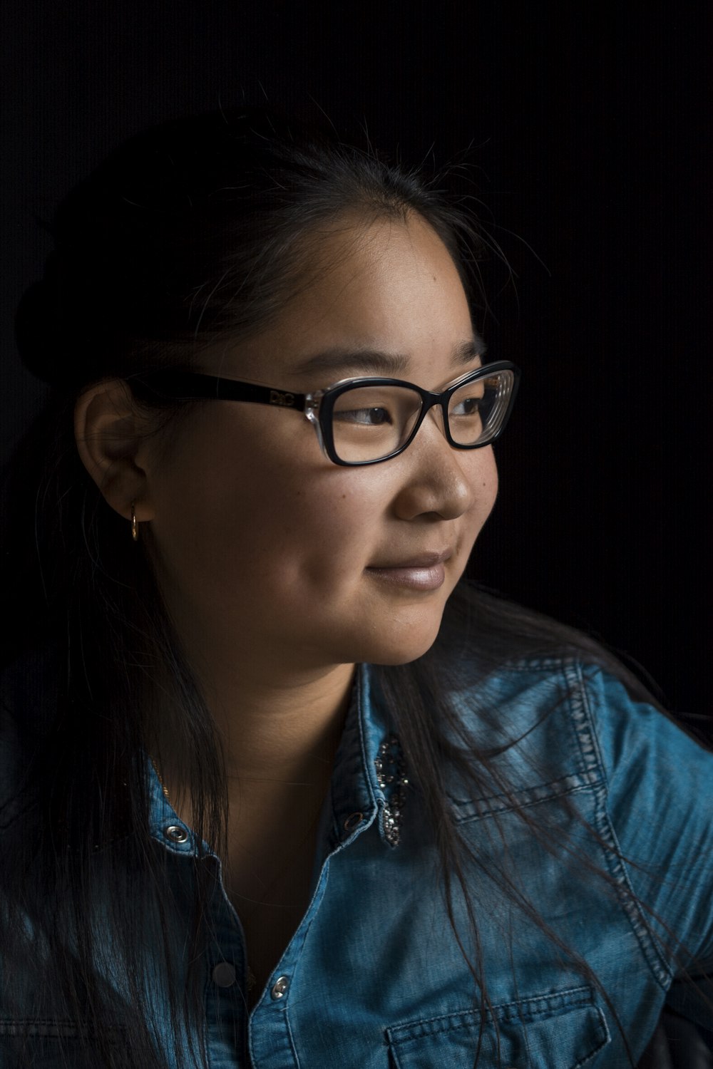 girl wearing black framed eyeglasses