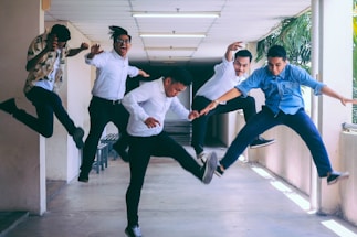 group of people doing jump shot photography