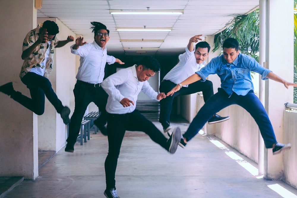 group of people doing jump shot photography