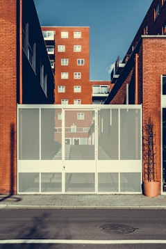 white metal gate closed during daytime