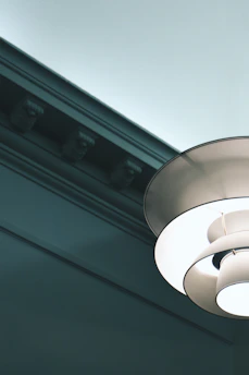 Close-up of decorative plaster molding with integrated LED lighting in a cozy room.