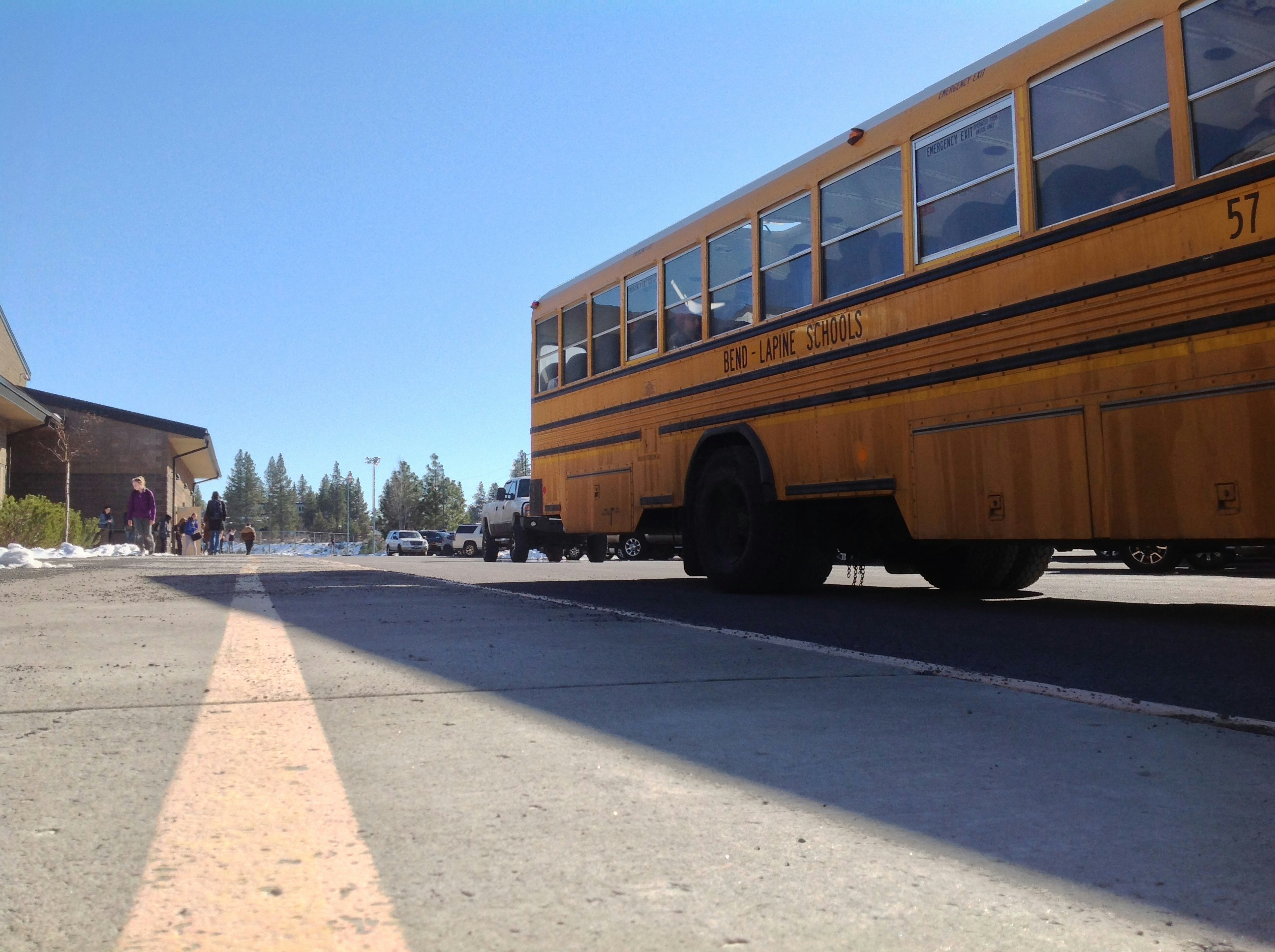 Yellow school bus on a clear day, safe transportation for students, bright exterior