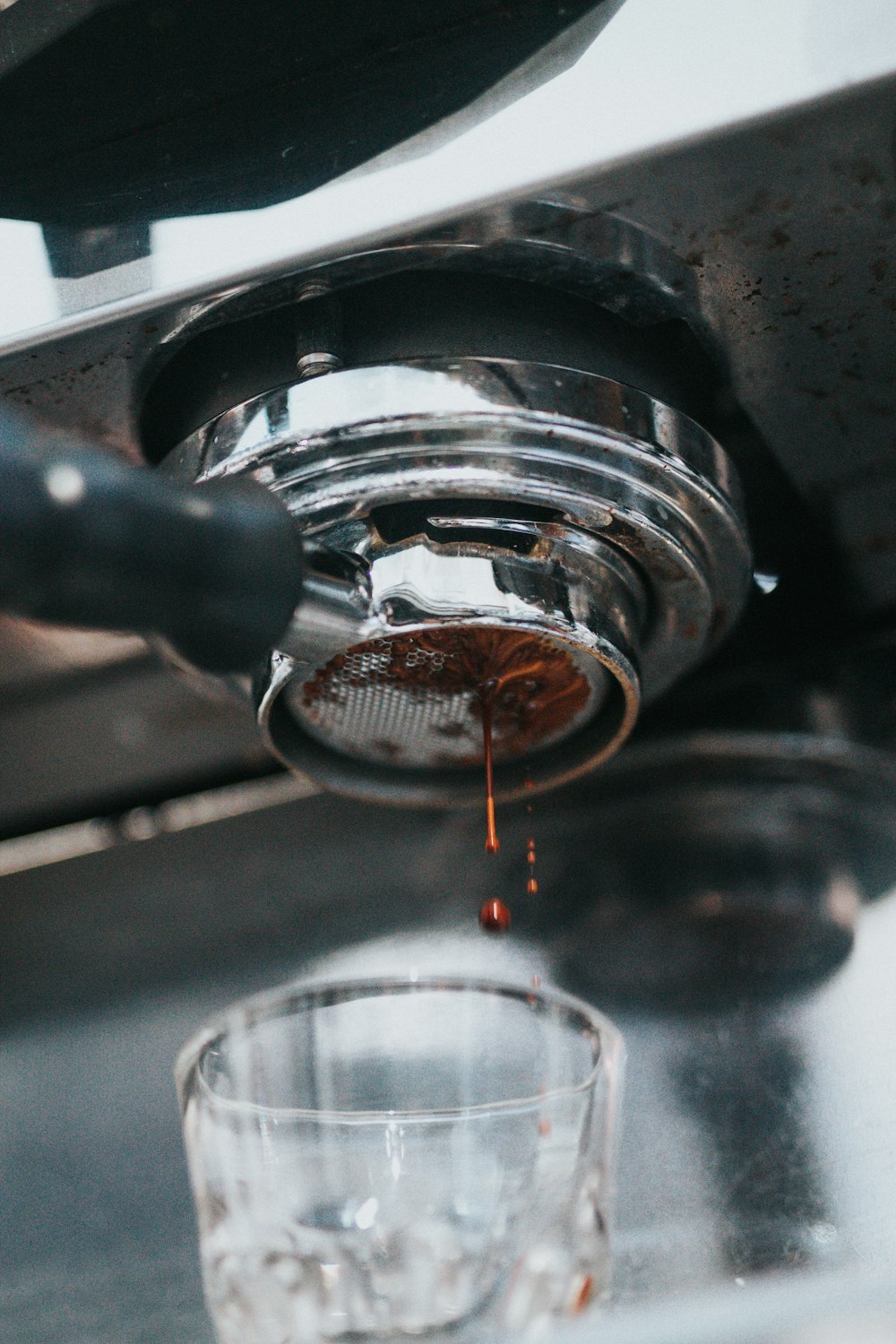 clear glass cup on coffeemaker