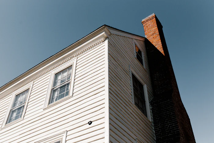 Tall chimney on a residential roofline