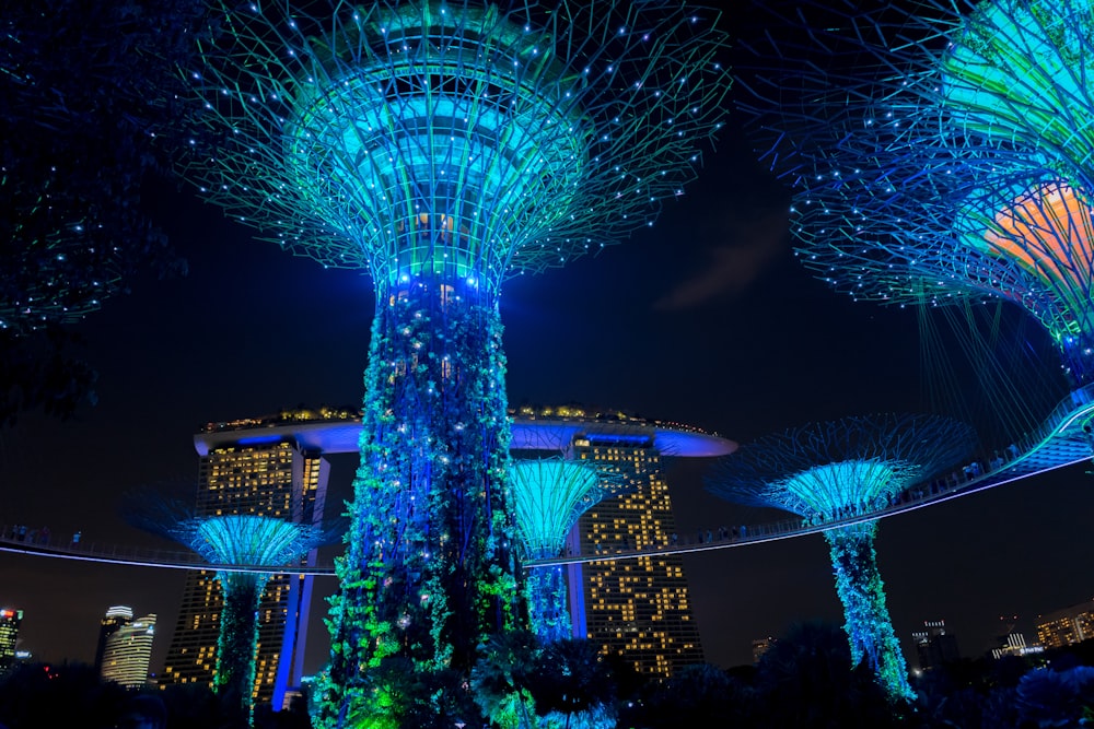 blue lighted towers during nighttime