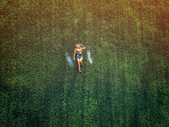 aerial view of woman laying on meadow in Naples United States