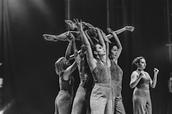 grayscale photo of women dancing