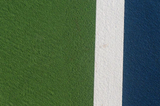 a close up of a green and blue wall
