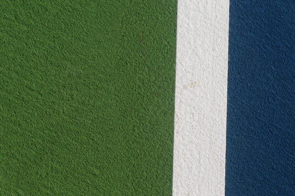 a close up of a green and blue wall