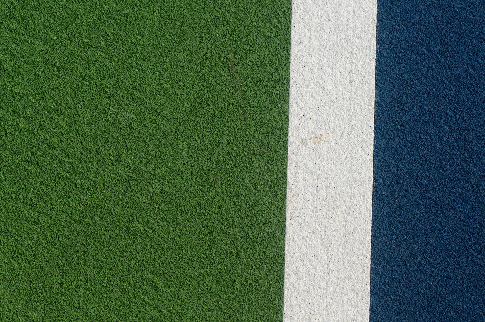 a close up of a green and blue wall