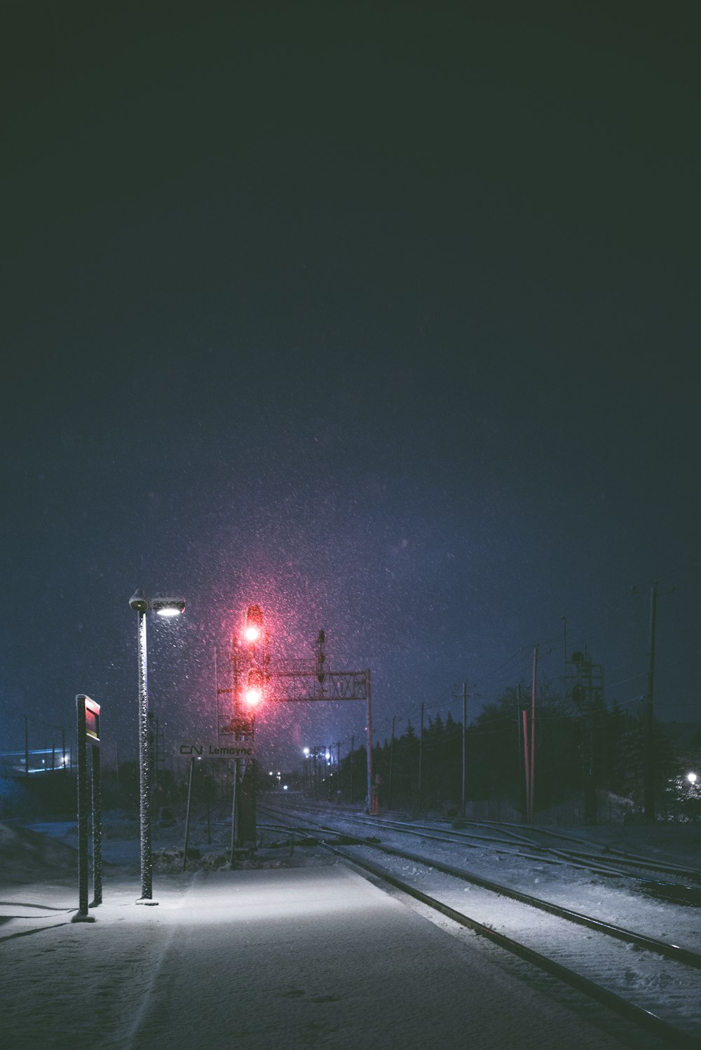 stop light on traffic light near rail road