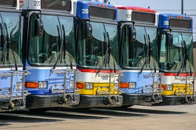 A fleet of buses ready for passenger transport.