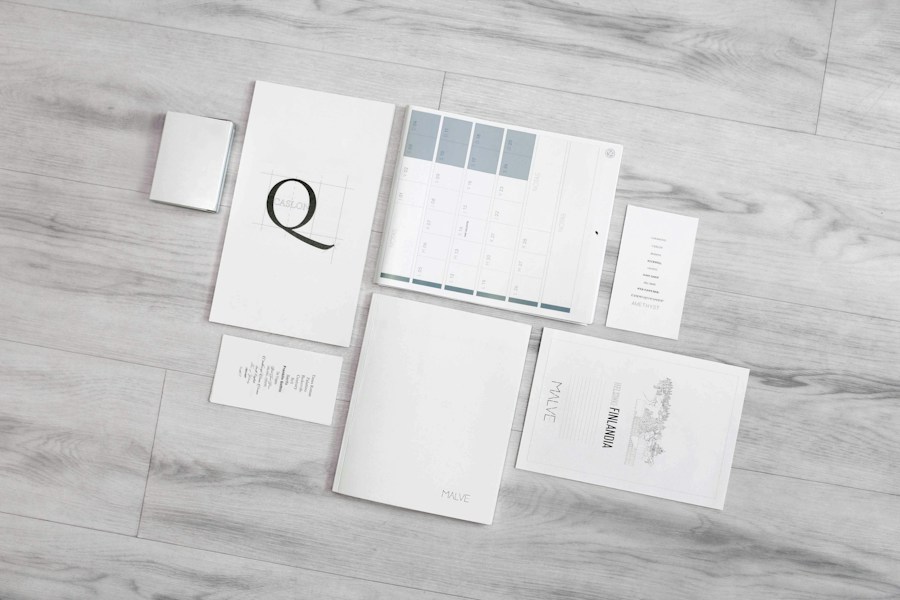 Stationery set laid out on a grey table