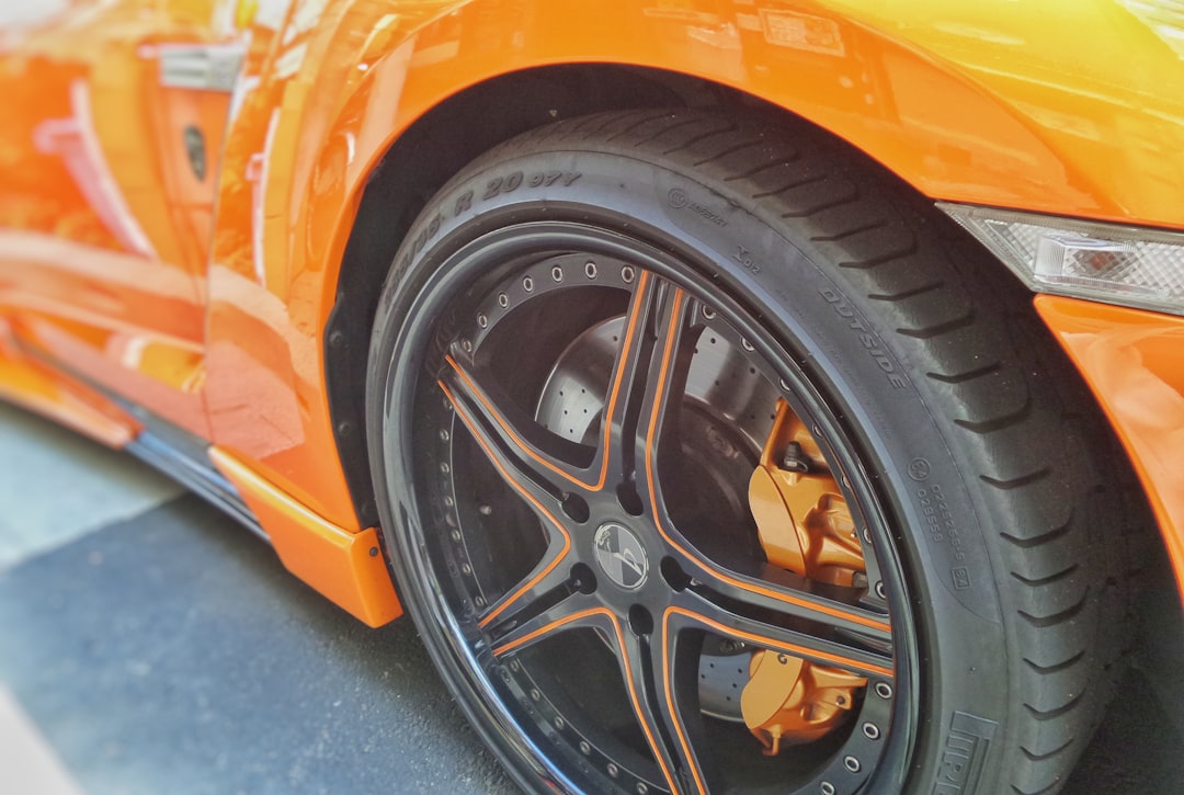 orange and black automotive rim