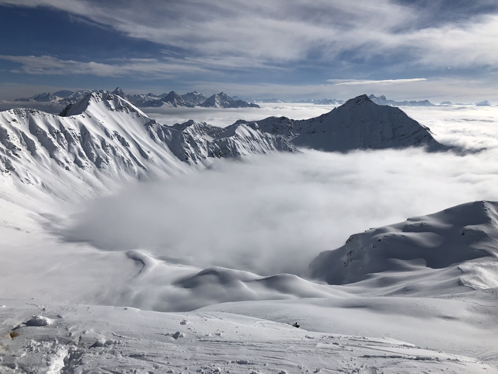 photo of ice coated mountain covered with fogs during daytime